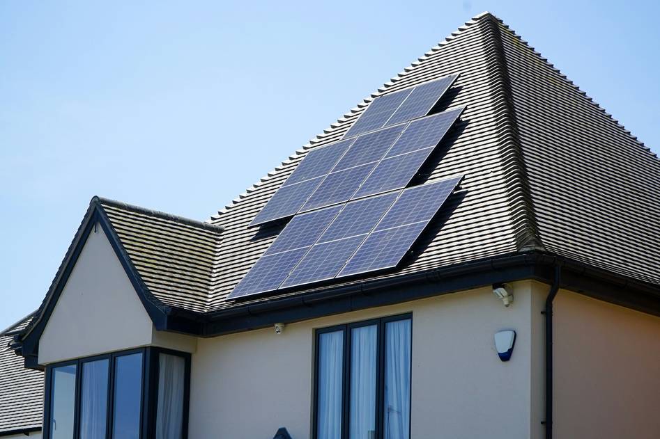 Close-up of high-quality solar panel cables connected to photovoltaic panels on a sunny rooftop